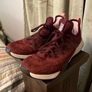 Burgundy and pink Nike women’s 9